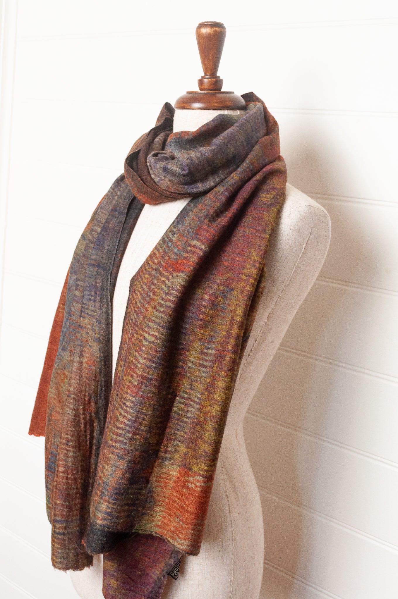 Neeru Kumar fine wool scarf digital print in abstract design with tones of rust, blue, charcoal and brown.
