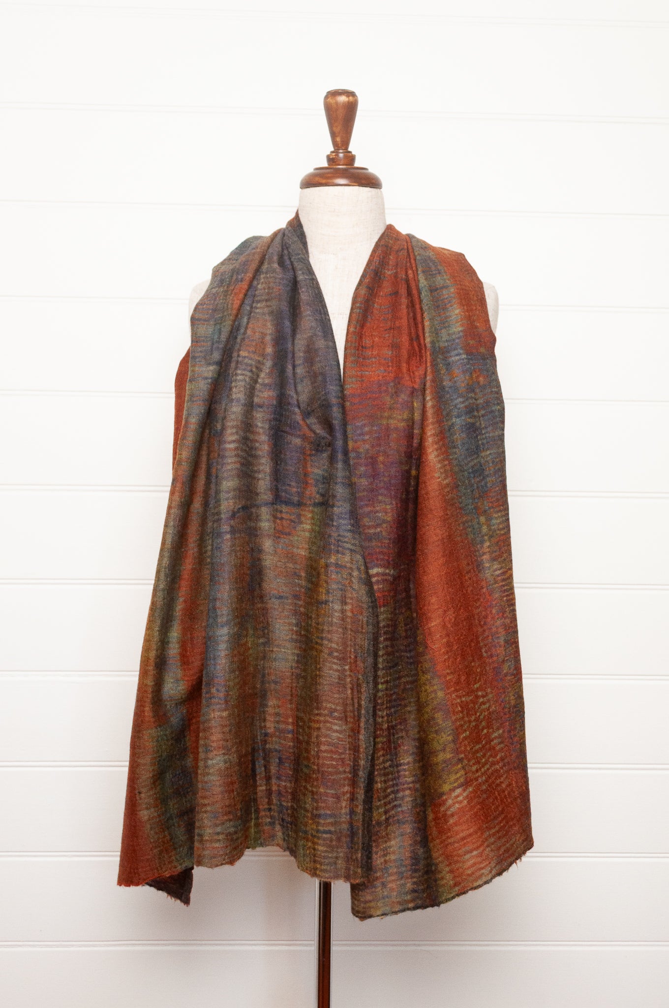 Neeru Kumar fine wool scarf digital print in abstract design with tones of rust, blue, charcoal and brown.