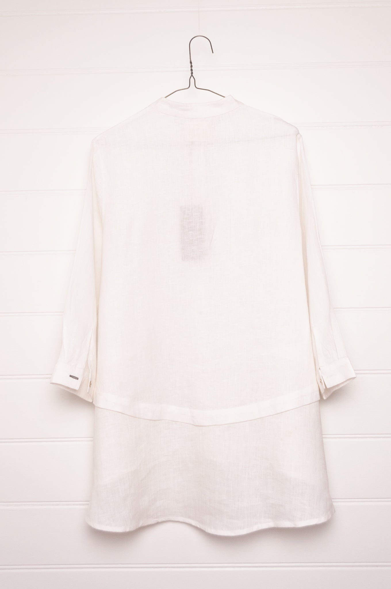 Manan Anaya white linen shirt with tailored seam detailing.