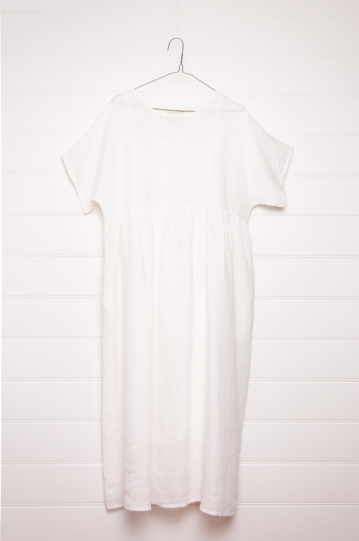 Manan Rasa sheer white linen dress with short sleeves, pleat detailing at the back.