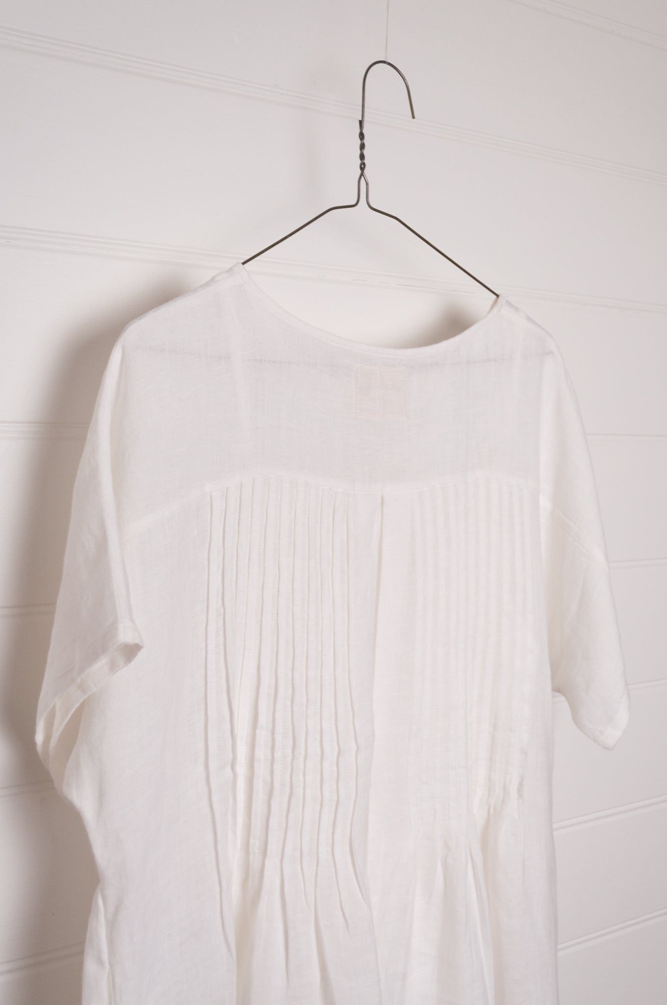 Manan Rasa sheer white linen dress with short sleeves, pleat detailing at the back.