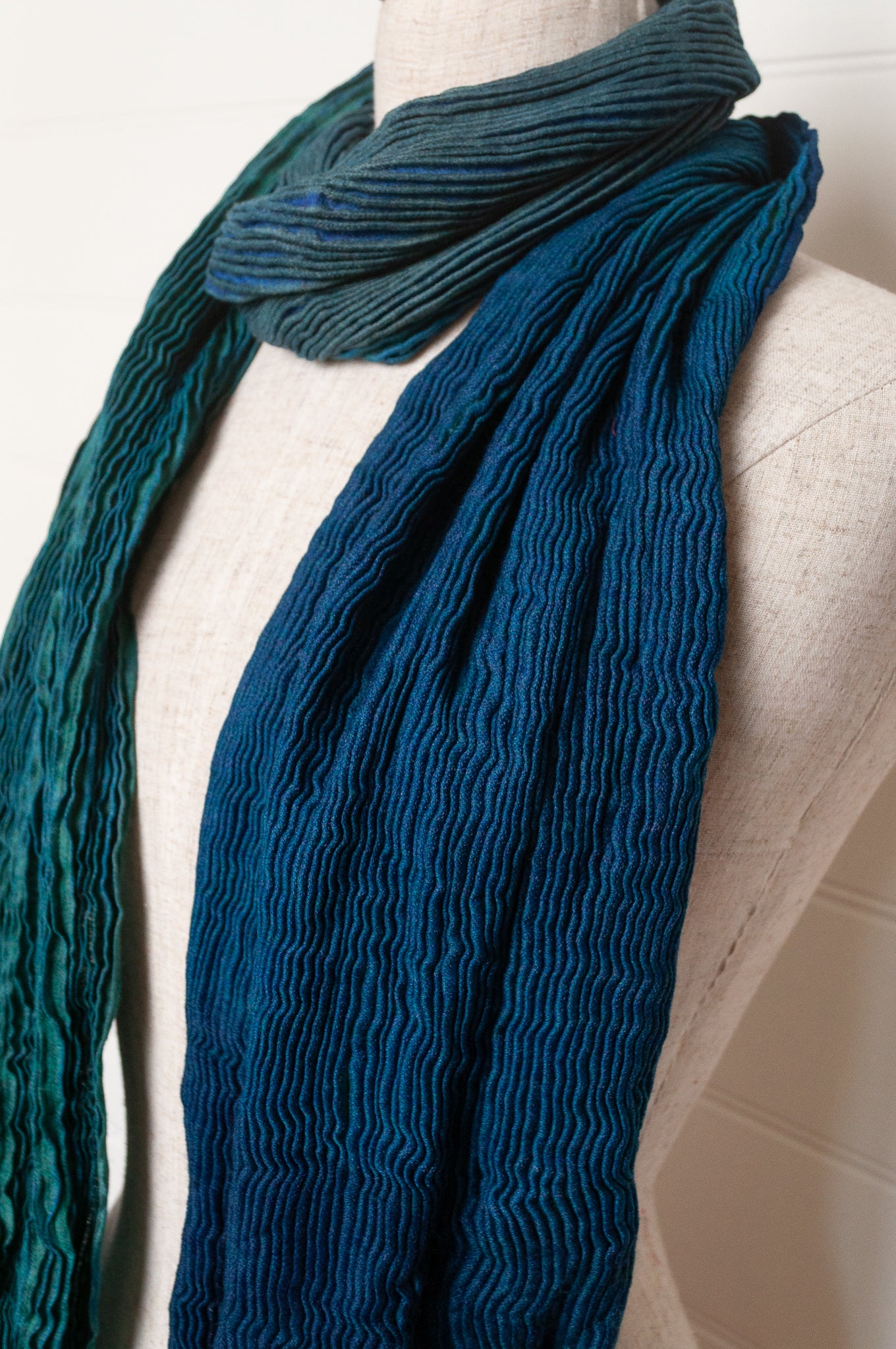 Neeru Kumar pure wool shibori dyed crinkle pleat finish scarf in marine blue, teal and aqua.
