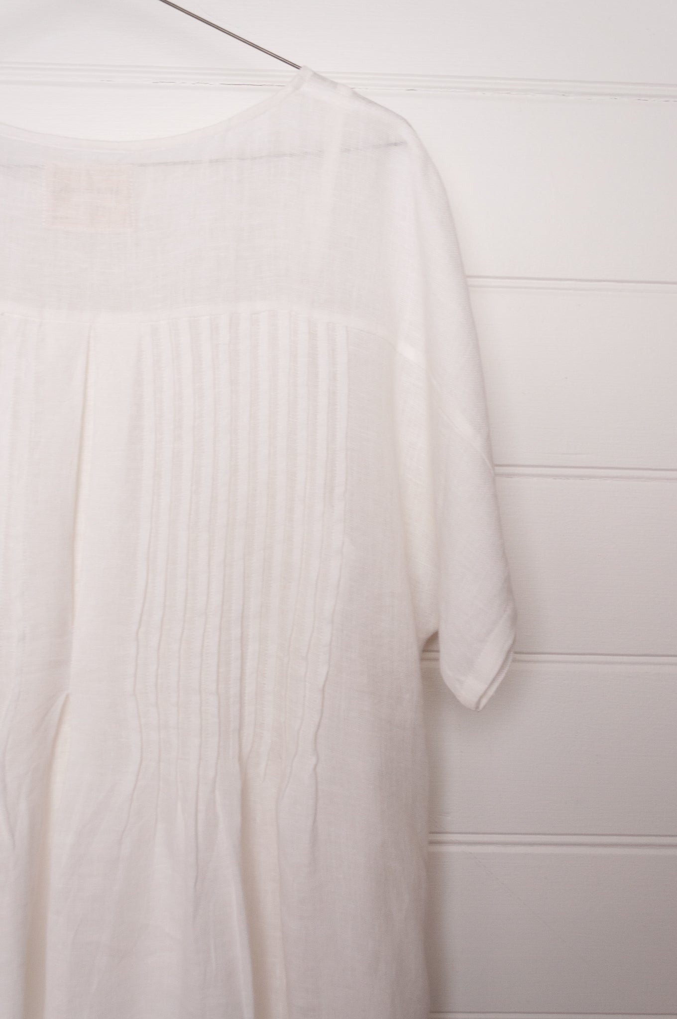 Manan Rasa sheer white linen dress with short sleeves, pleat detailing at the back.
