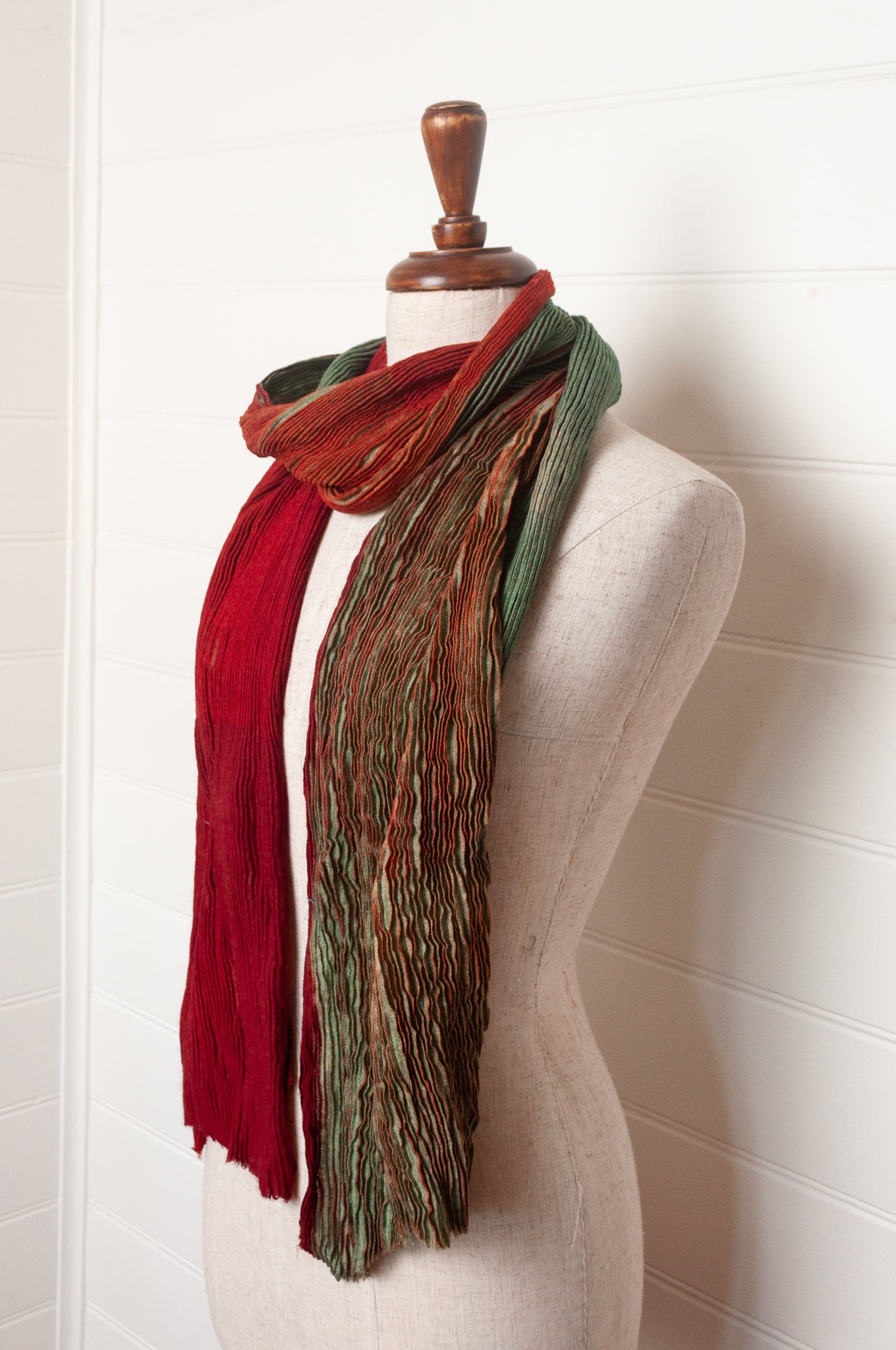 Neeru Kumar pure wool shibori dyed crinkle pleat finish scarf in ruby red and aquamarine blue.