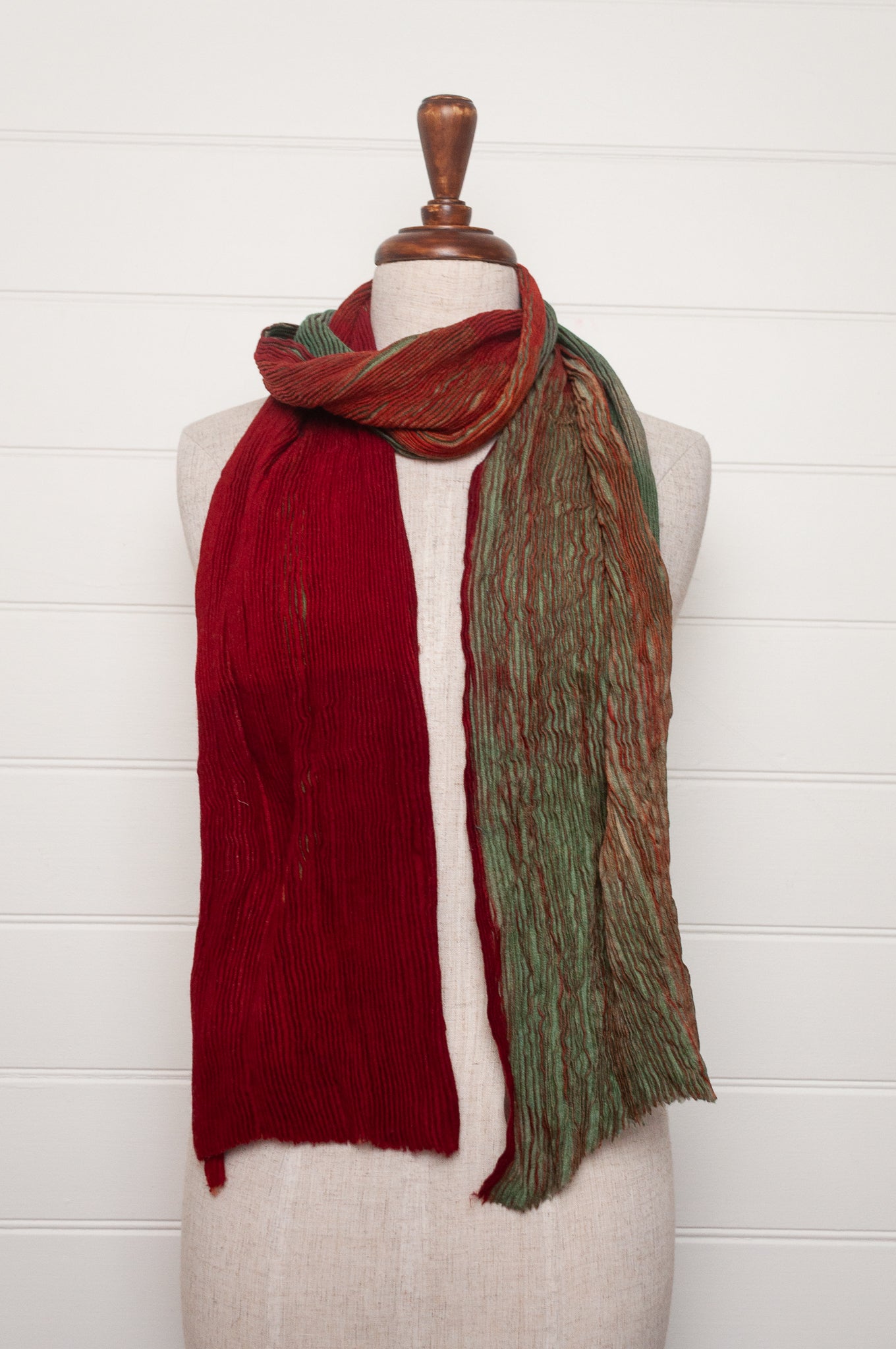 Neeru Kumar pure wool shibori dyed crinkle pleat finish scarf in ruby red and aquamarine blue.