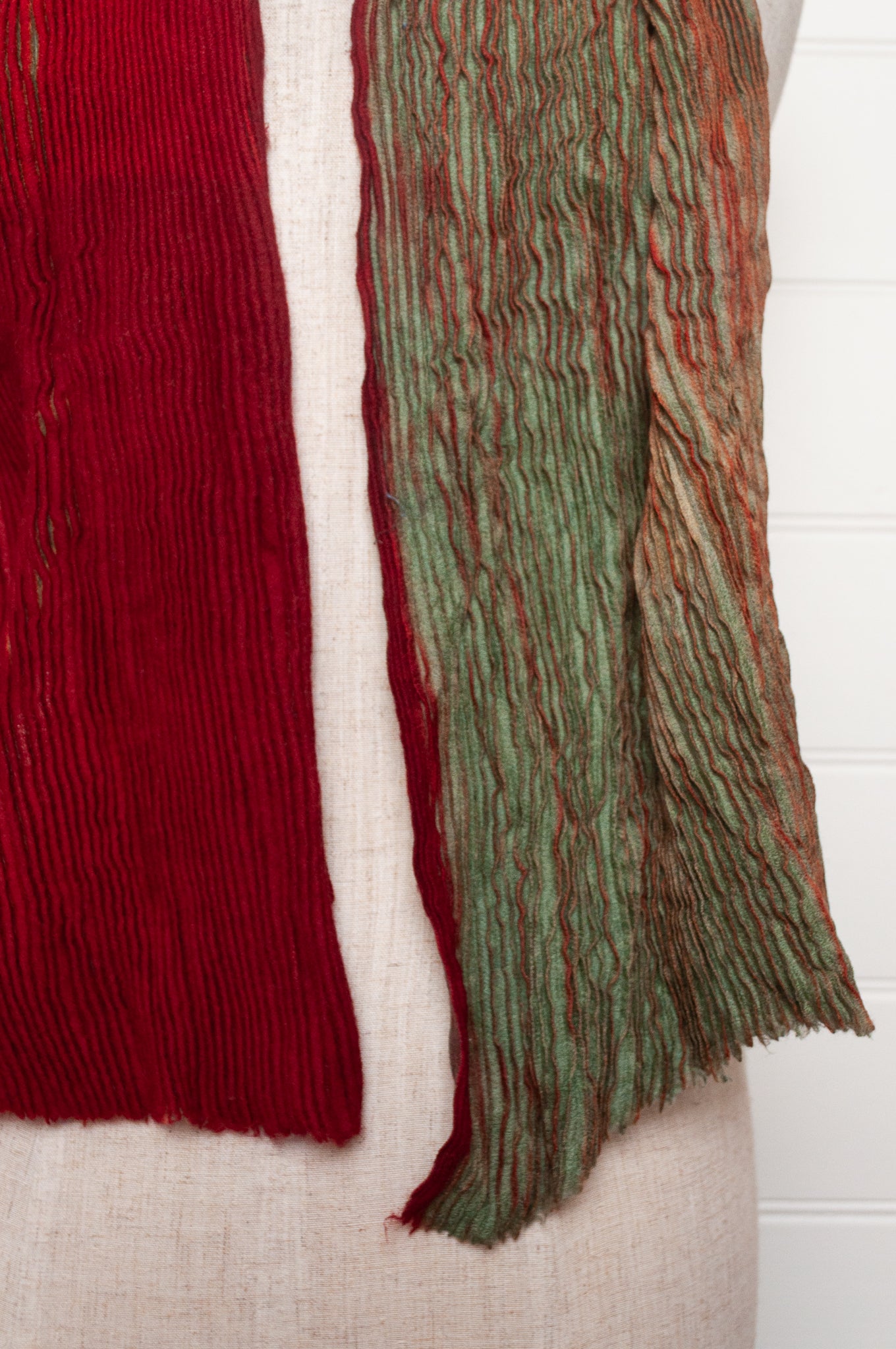 Neeru Kumar pure wool shibori dyed crinkle pleat finish scarf in ruby red and aquamarine blue.