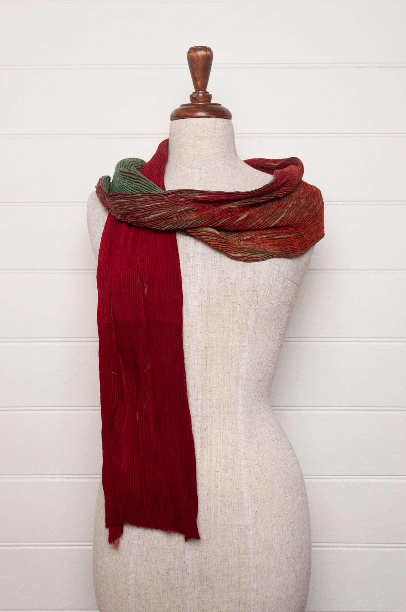 Neeru Kumar pure wool shibori dyed crinkle pleat finish scarf in ruby red and aquamarine blue.