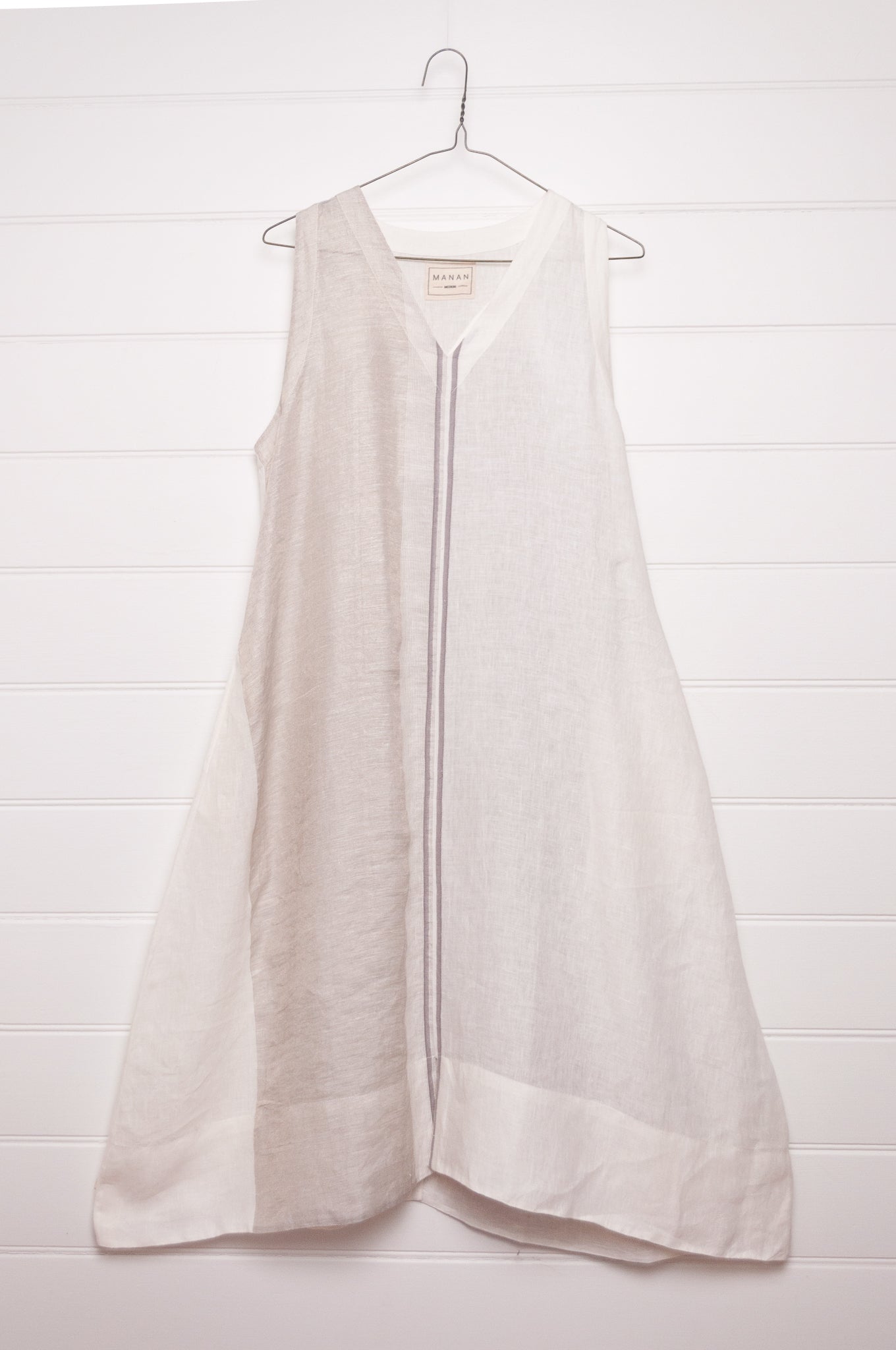 Manan Ayana V-neck sleeveless linen tunic dress with handwoven metallic border, stripe panels, selvedge detailing and hand-embroidery.