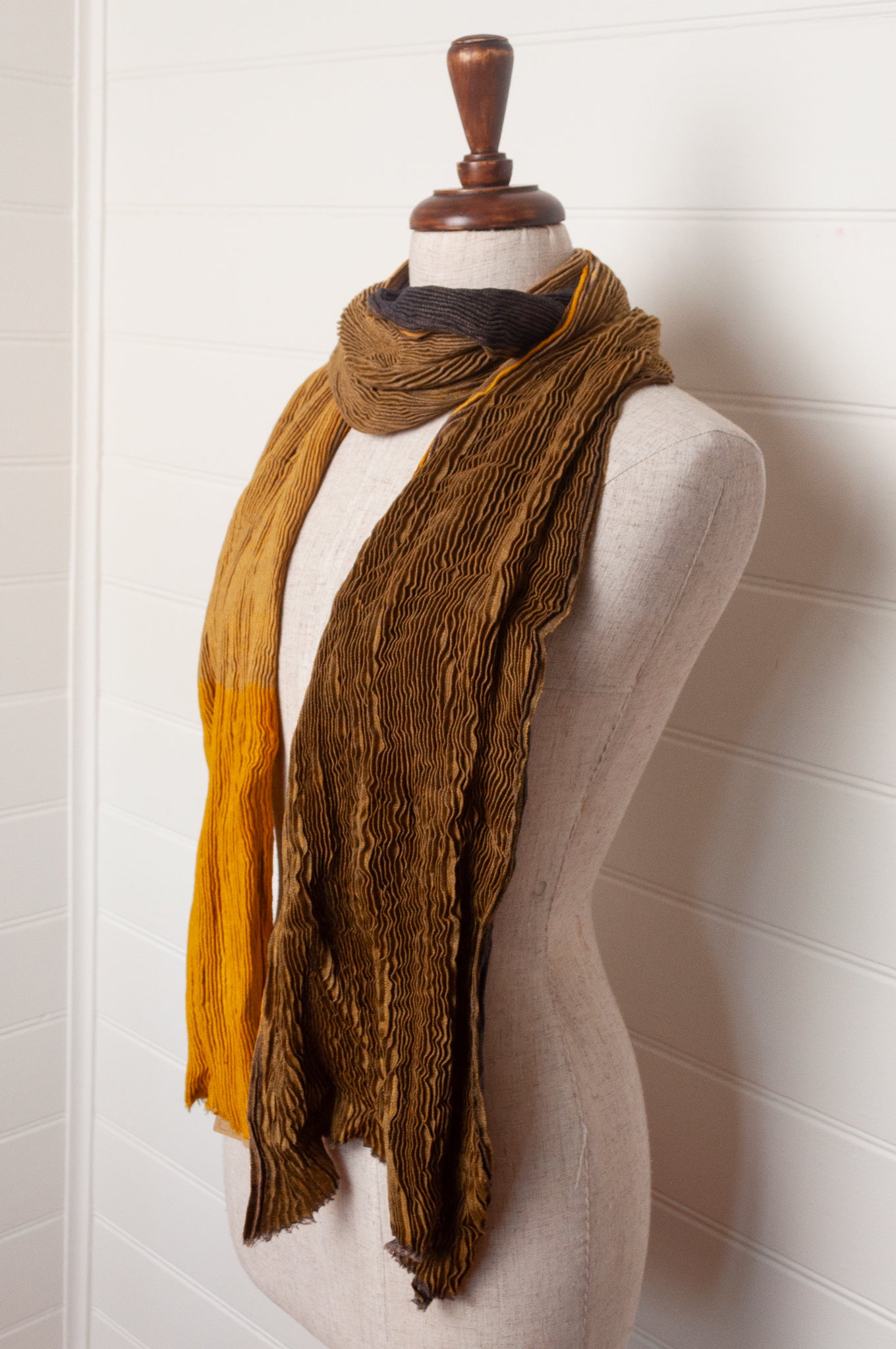 Neeru Kumar pure wool shibori dyed crinkle pleat finish scarf in gold and brown.