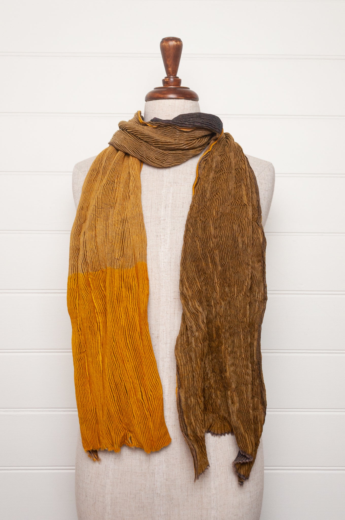 Neeru Kumar pure wool shibori dyed crinkle pleat finish scarf in gold and brown.