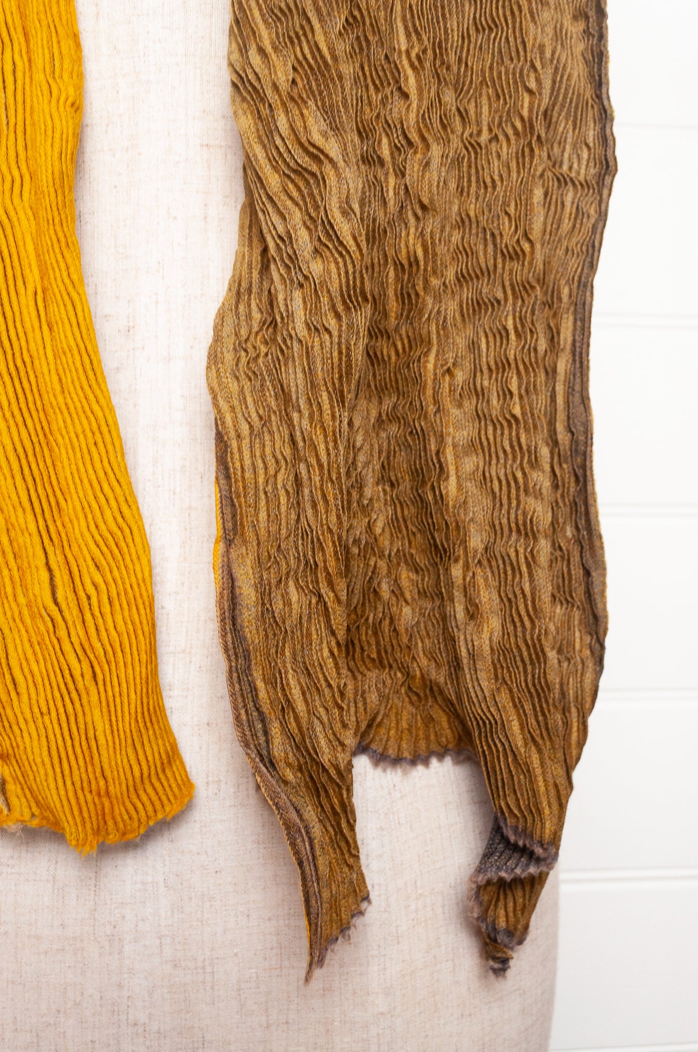 Neeru Kumar pure wool shibori dyed crinkle pleat finish scarf in gold and brown.