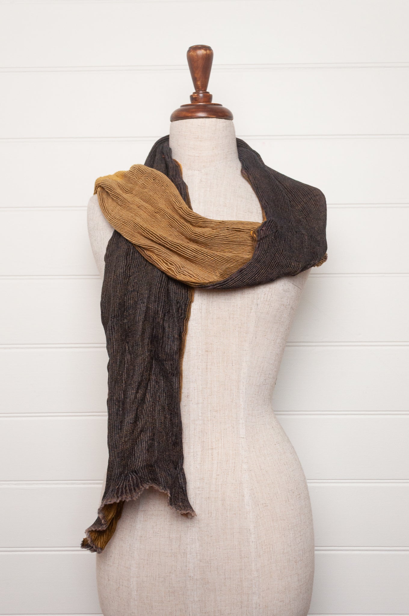 Neeru Kumar pure wool shibori dyed crinkle pleat finish scarf in gold and brown.