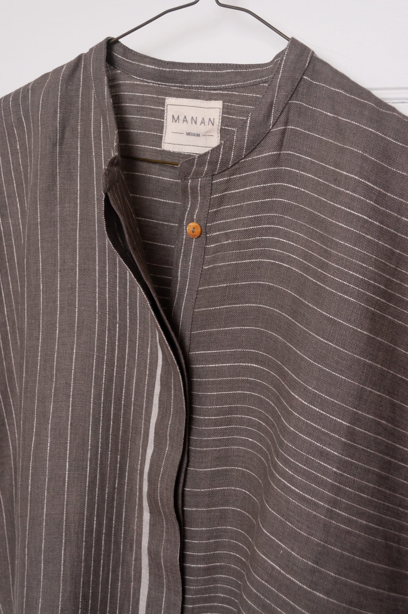 Manan Madhavi button up top in yarn-dyed grey and white stripe linen with panel detailing.