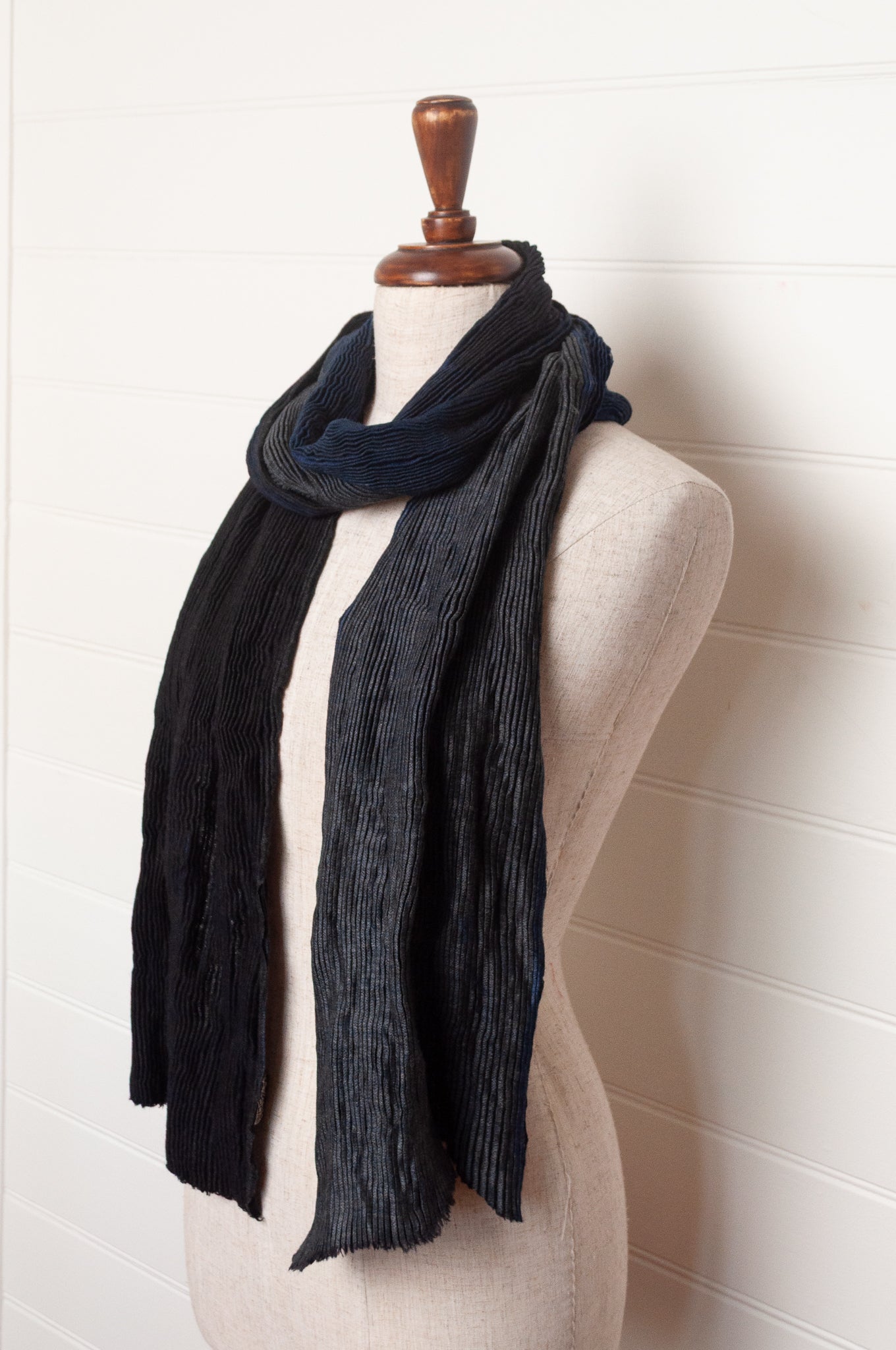 Neeru Kumar pure wool shibori dyed crinkle pleat finish scarf in indigo blue, and charcoal grey.