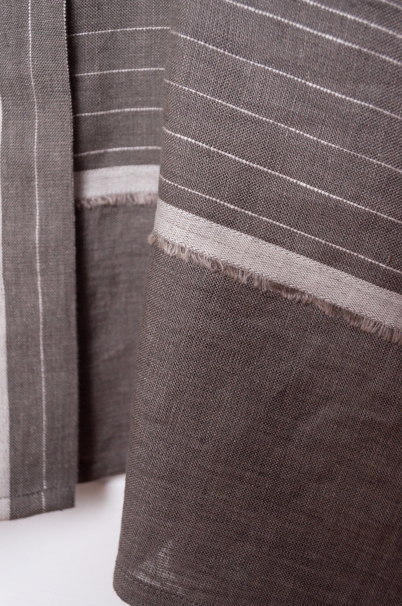 Manan Madhavi button up top in yarn-dyed grey and white stripe linen with panel detailing.