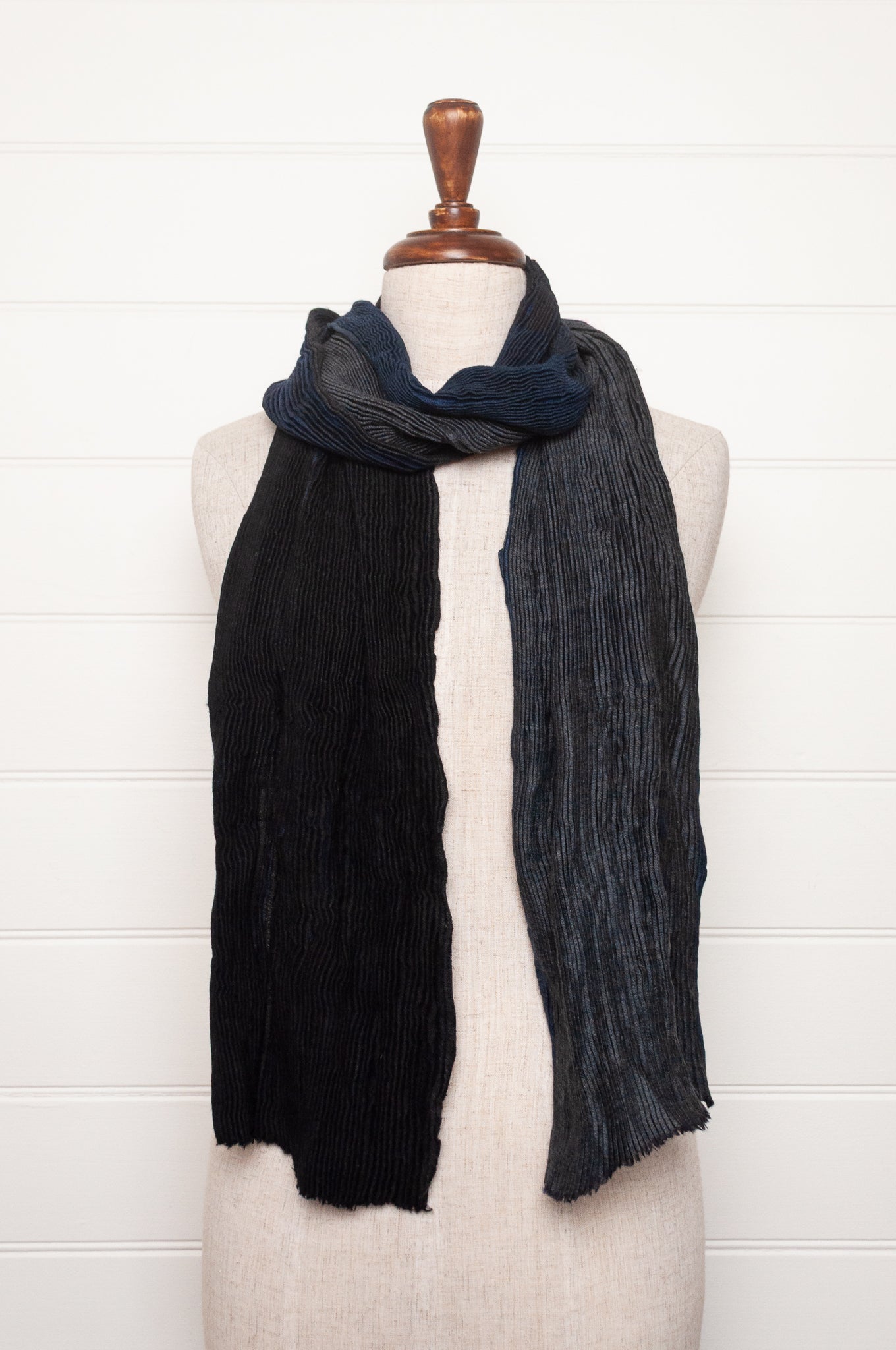 Neeru Kumar pure wool shibori dyed crinkle pleat finish scarf in indigo blue, and charcoal grey.
