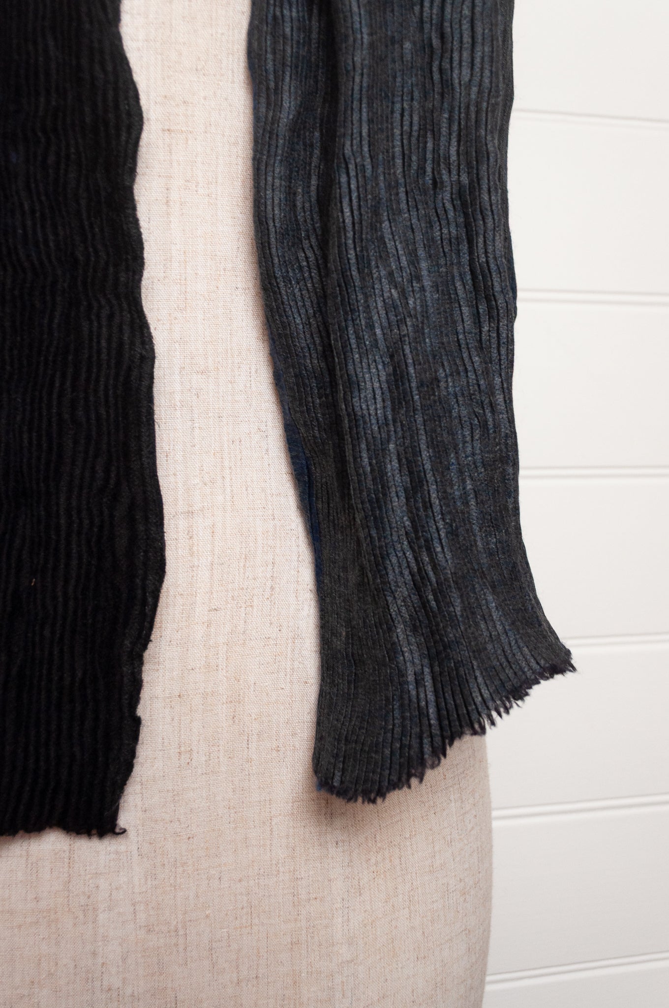 Neeru Kumar pure wool shibori dyed crinkle pleat finish scarf in indigo blue, and charcoal grey.