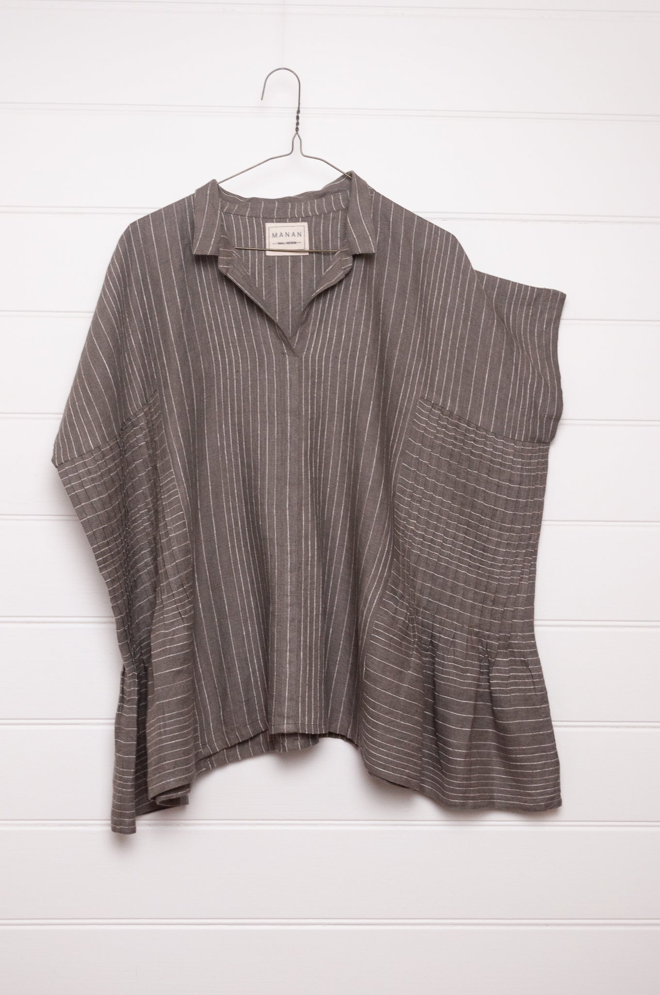 Manan Bonnie loose-fitting button up top with side pleat detailing in yarn-dyed stripe grey and white linen.