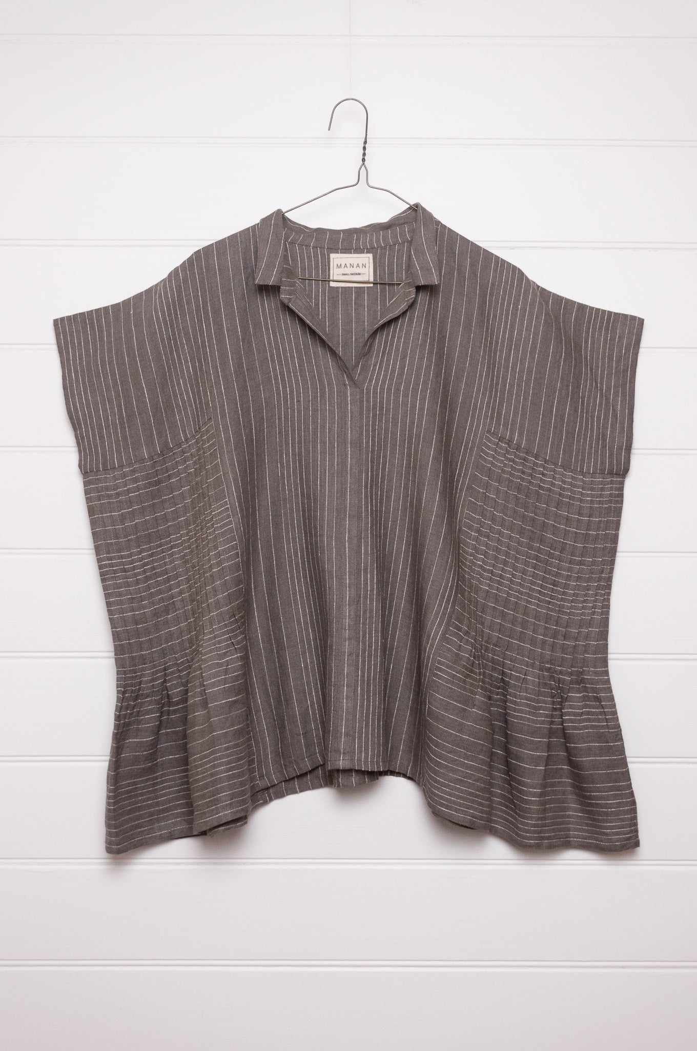 Manan Bonnie loose-fitting button up top with side pleat detailing in yarn-dyed stripe grey and white linen.