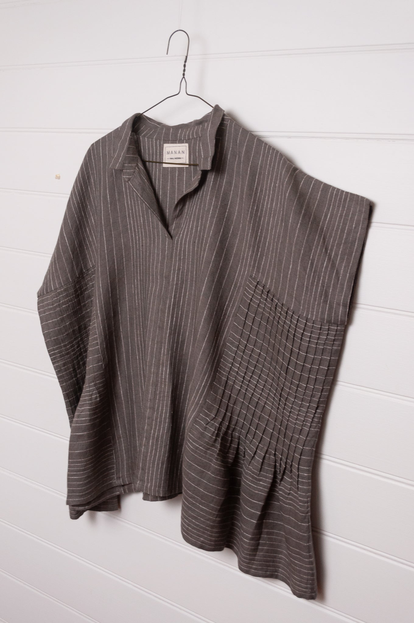 Manan Bonnie loose-fitting button up top with side pleat detailing in yarn-dyed stripe grey and white linen.