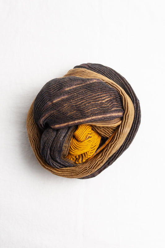 Neeru Kumar pure wool shibori dyed crinkle pleat finish scarf in gold and brown.