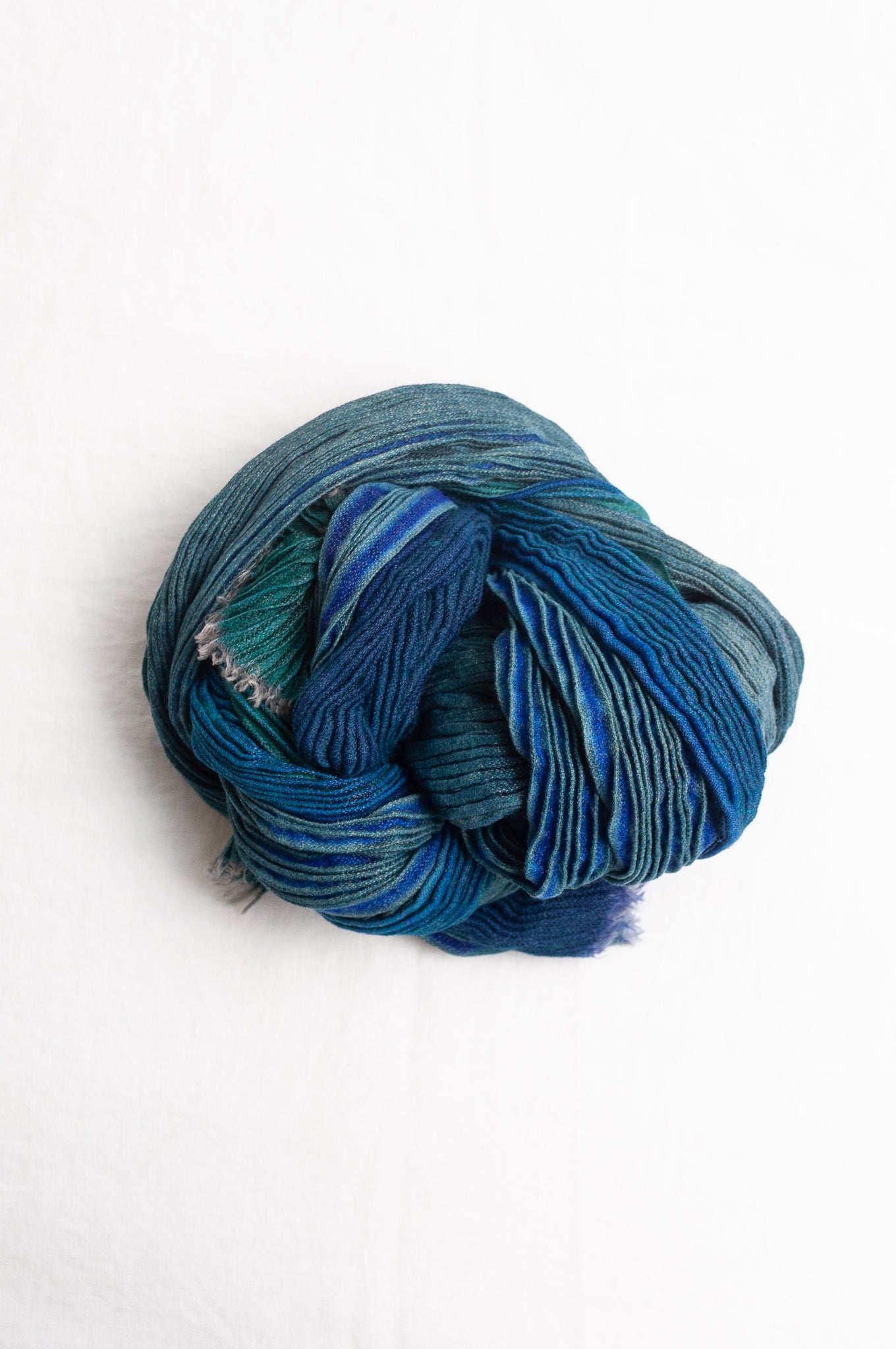 Neeru Kumar pure wool shibori dyed crinkle pleat finish scarf in marine blue, teal and aqua.