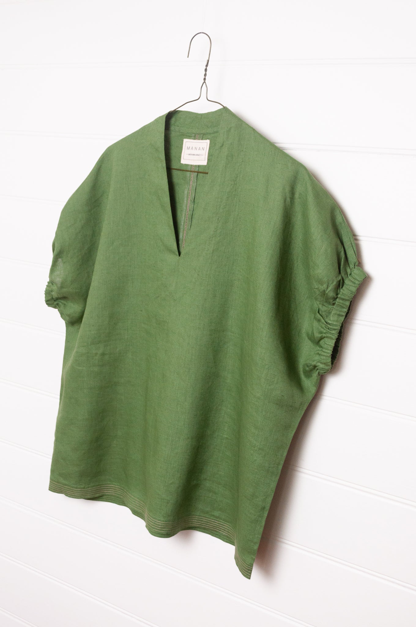 Manan Hoshi top in green linen, V-neck with elasticated sleeves.