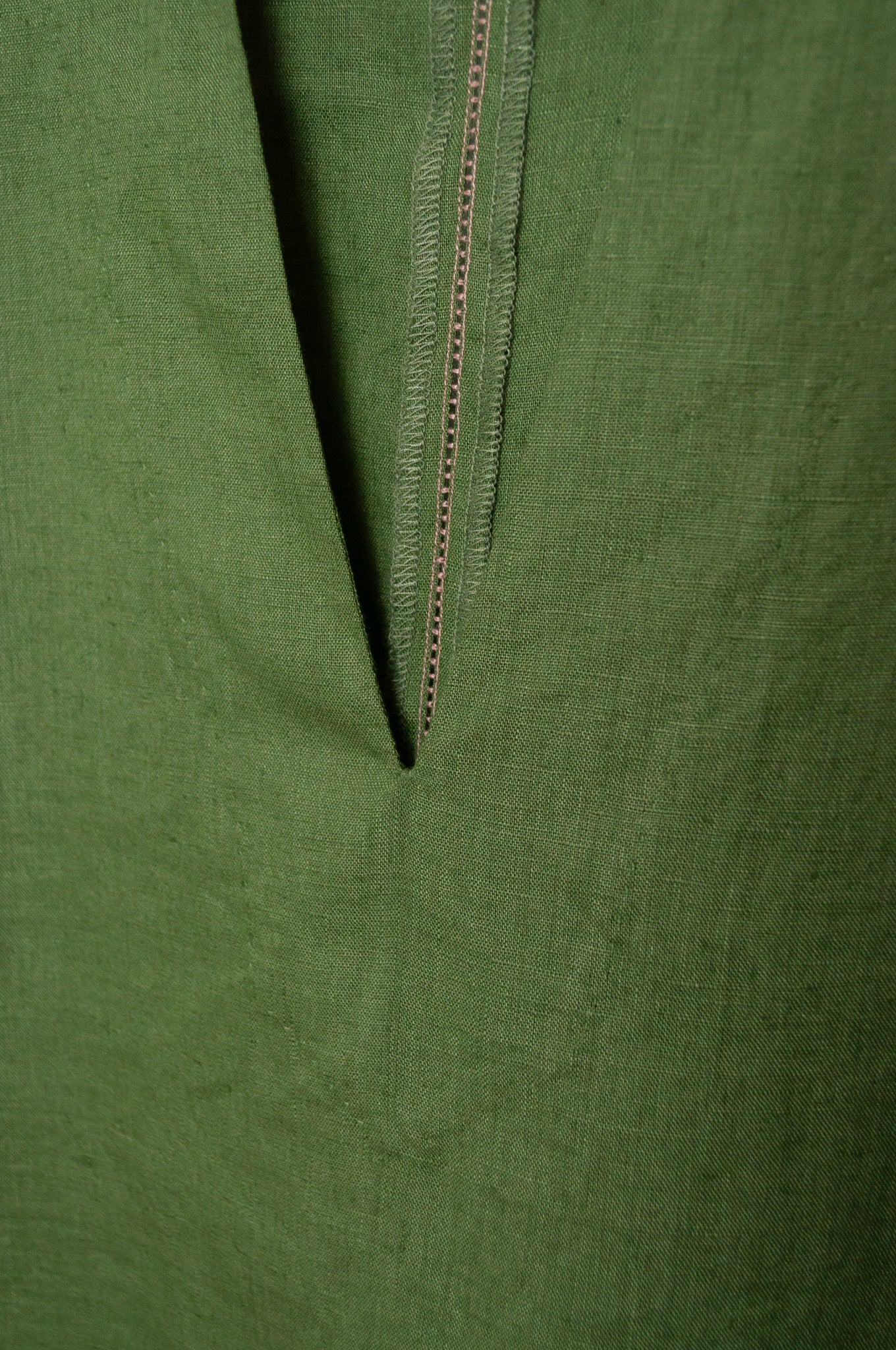 Manan Hoshi top in green linen, V-neck with elasticated sleeves.