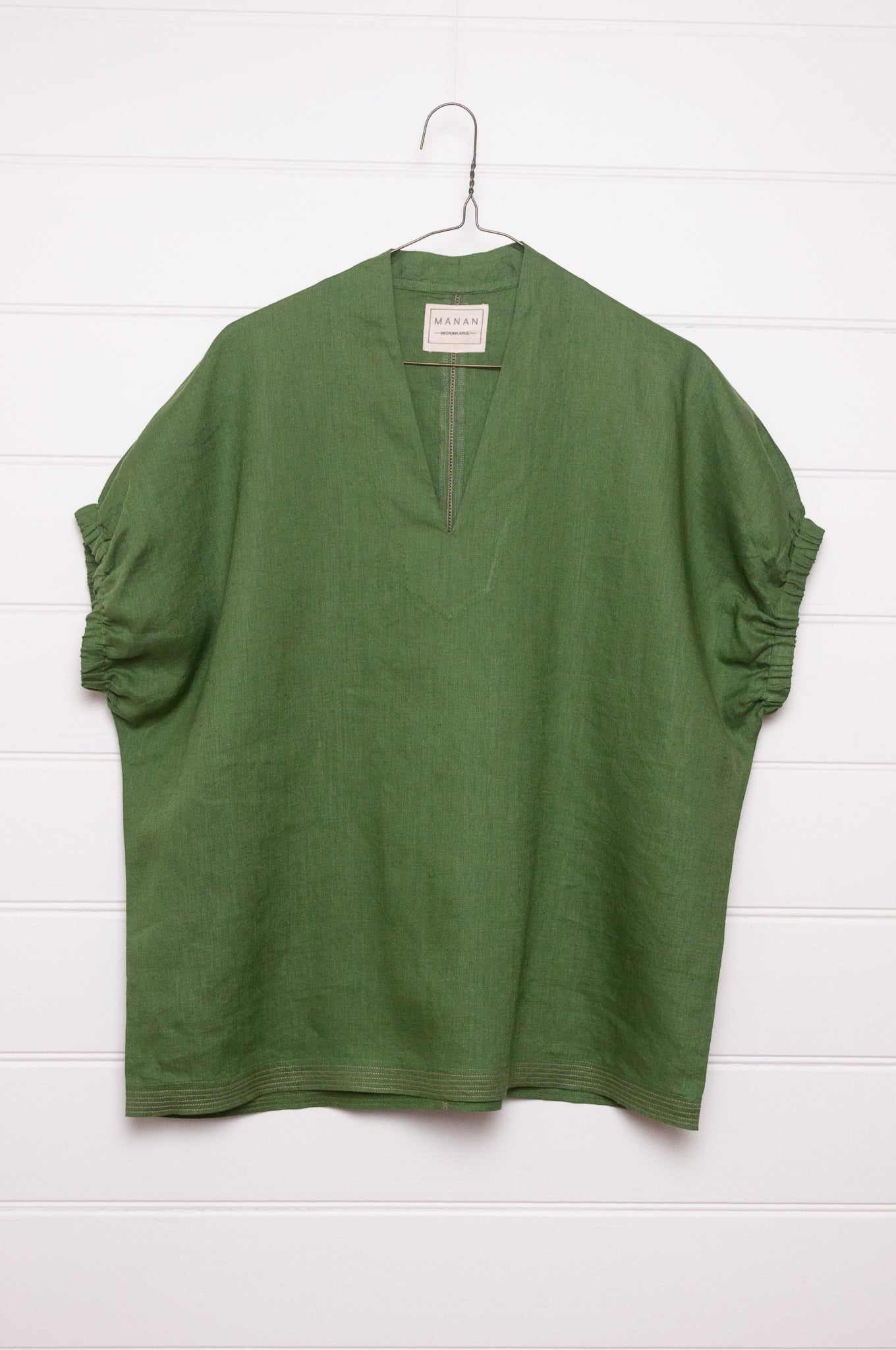 Manan Hoshi top in green linen, V-neck with elasticated sleeves.
