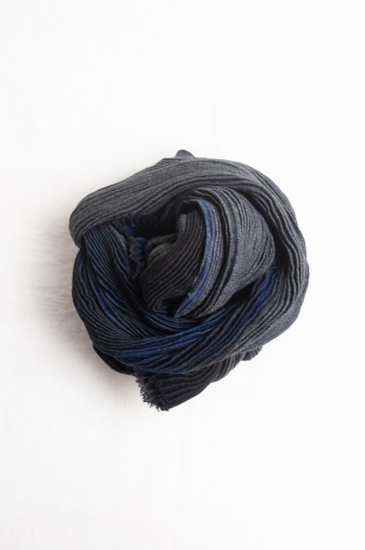 Neeru Kumar pure wool shibori dyed crinkle pleat finish scarf in indigo blue, and charcoal grey.