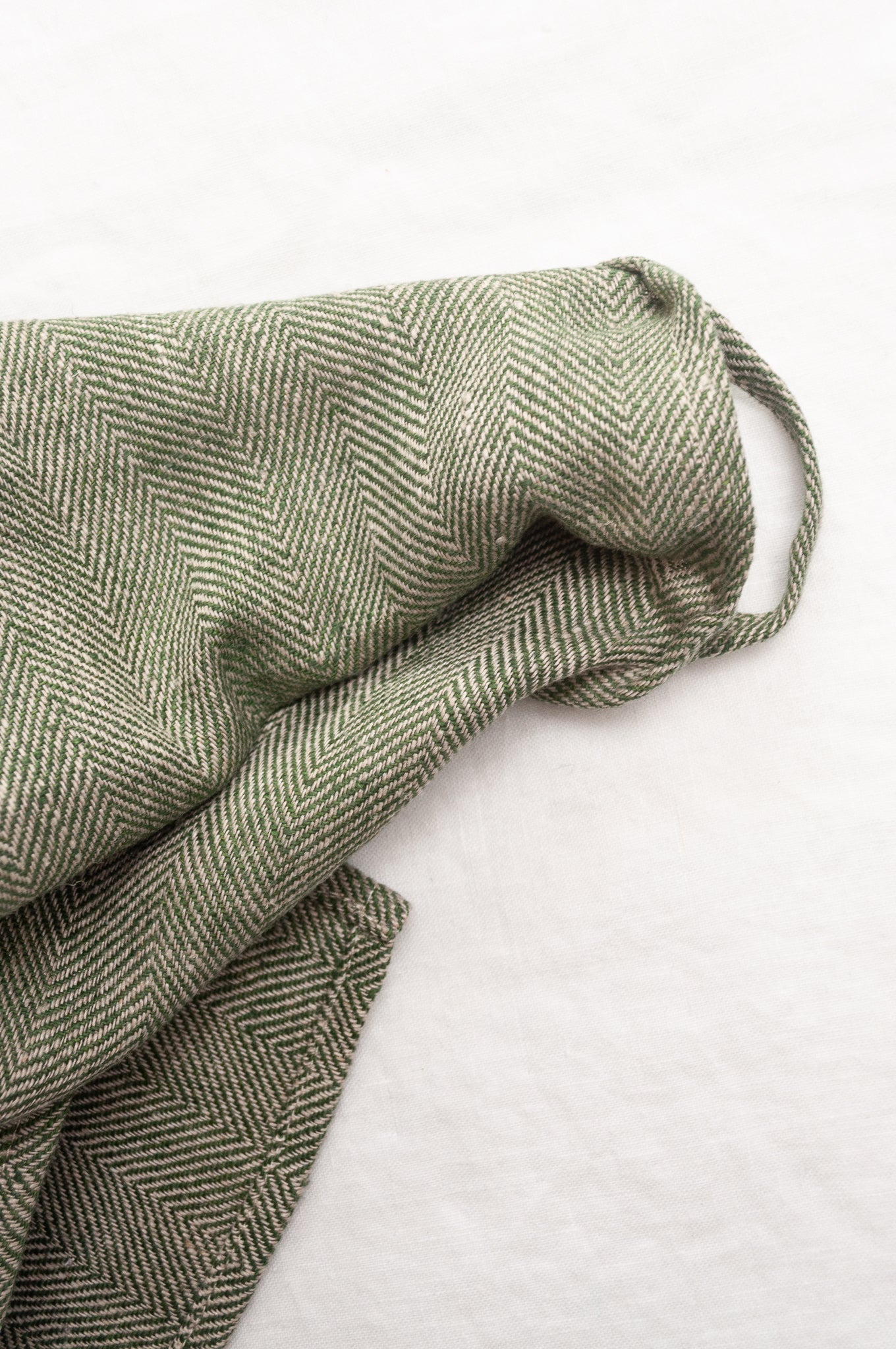 Made in Lithuania pure linen chevron weave tea towel in olive green and white.