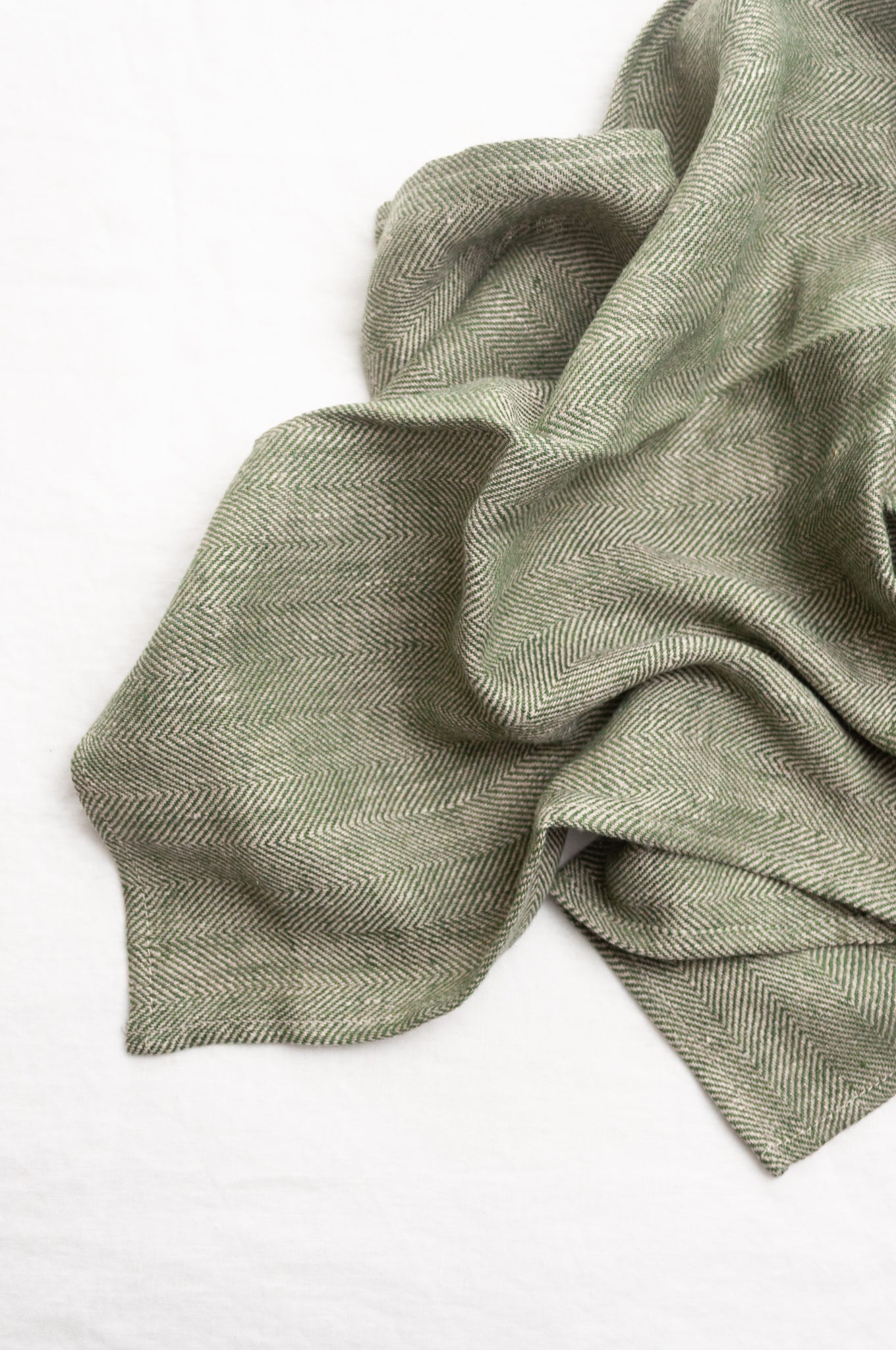 Made in Lithuania pure linen chevron weave tea towel in olive green and white.