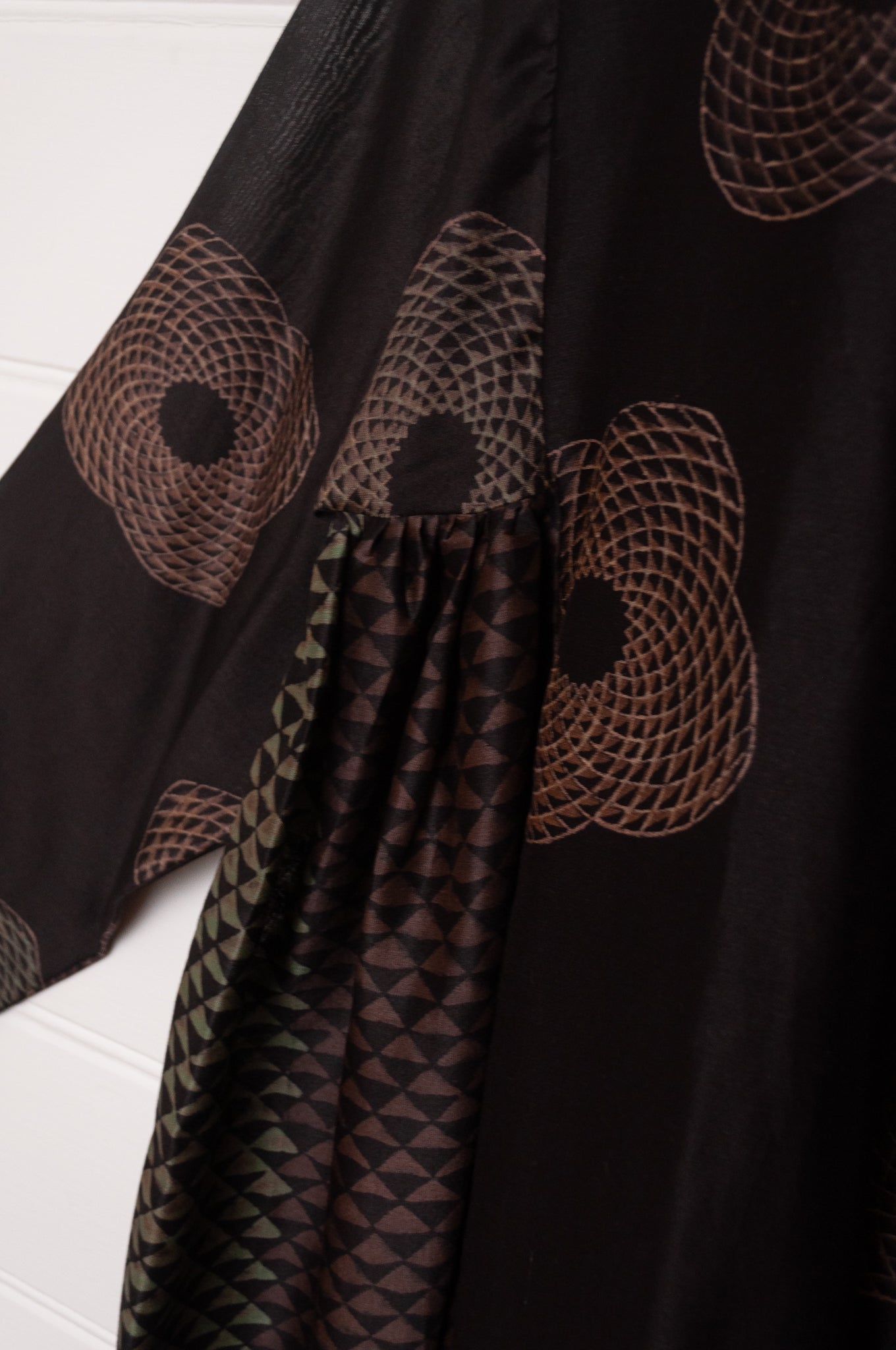 Brahma Karma chanderi cotton silk ebony tunic dress with bronze flowers and geometric side panels.