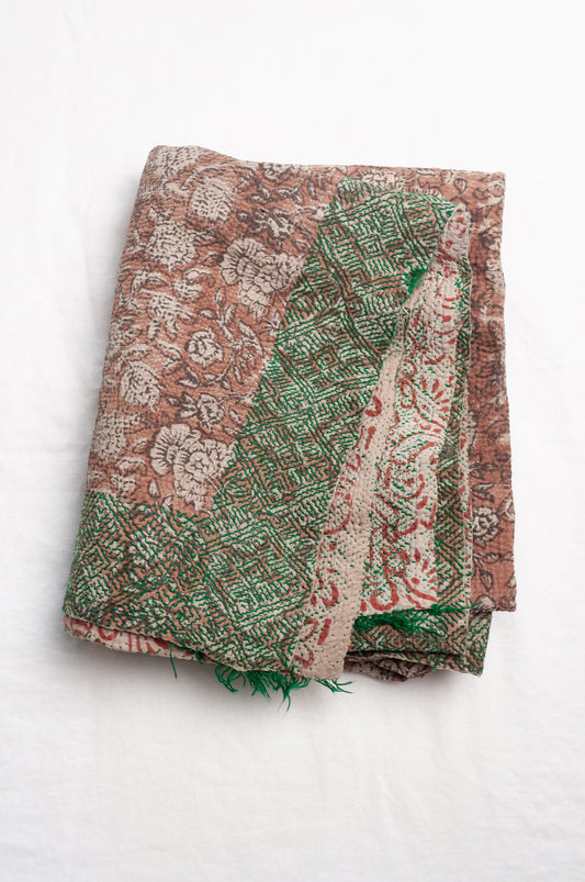 Vintage kantha quilt Bagru blockprinted in brown, floral design with green braid edging embroidery.