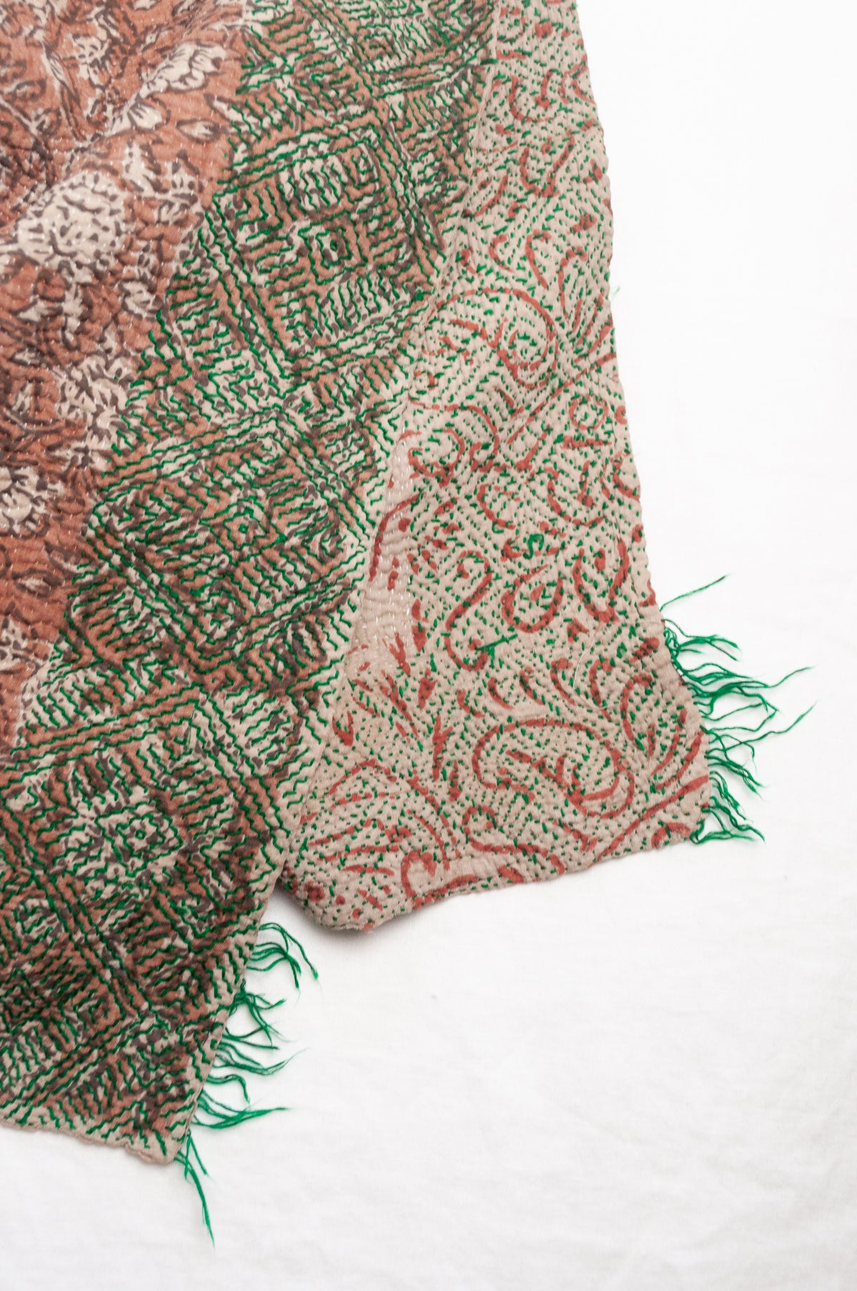 Vintage kantha quilt Bagru blockprinted in brown, floral design with green braid edging embroidery.