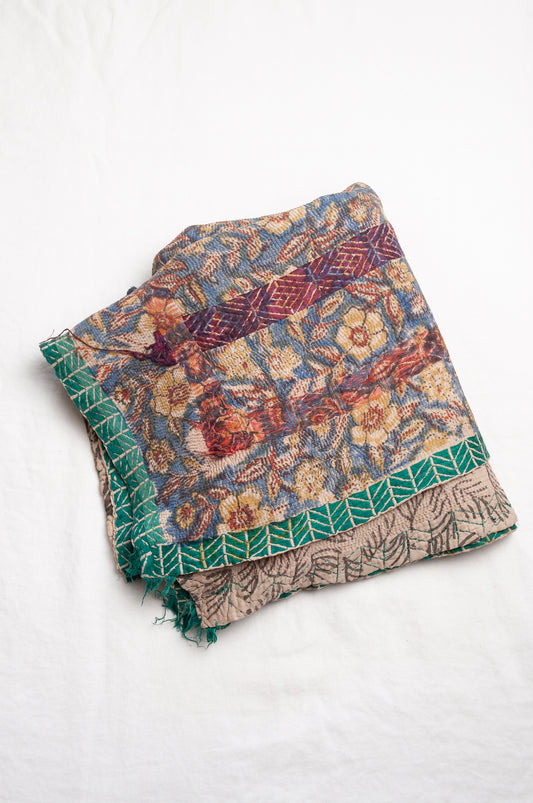 Vintage kantha quilt Bagru blockprinted in indigo, floral design with red, blue and green braid embroidery.