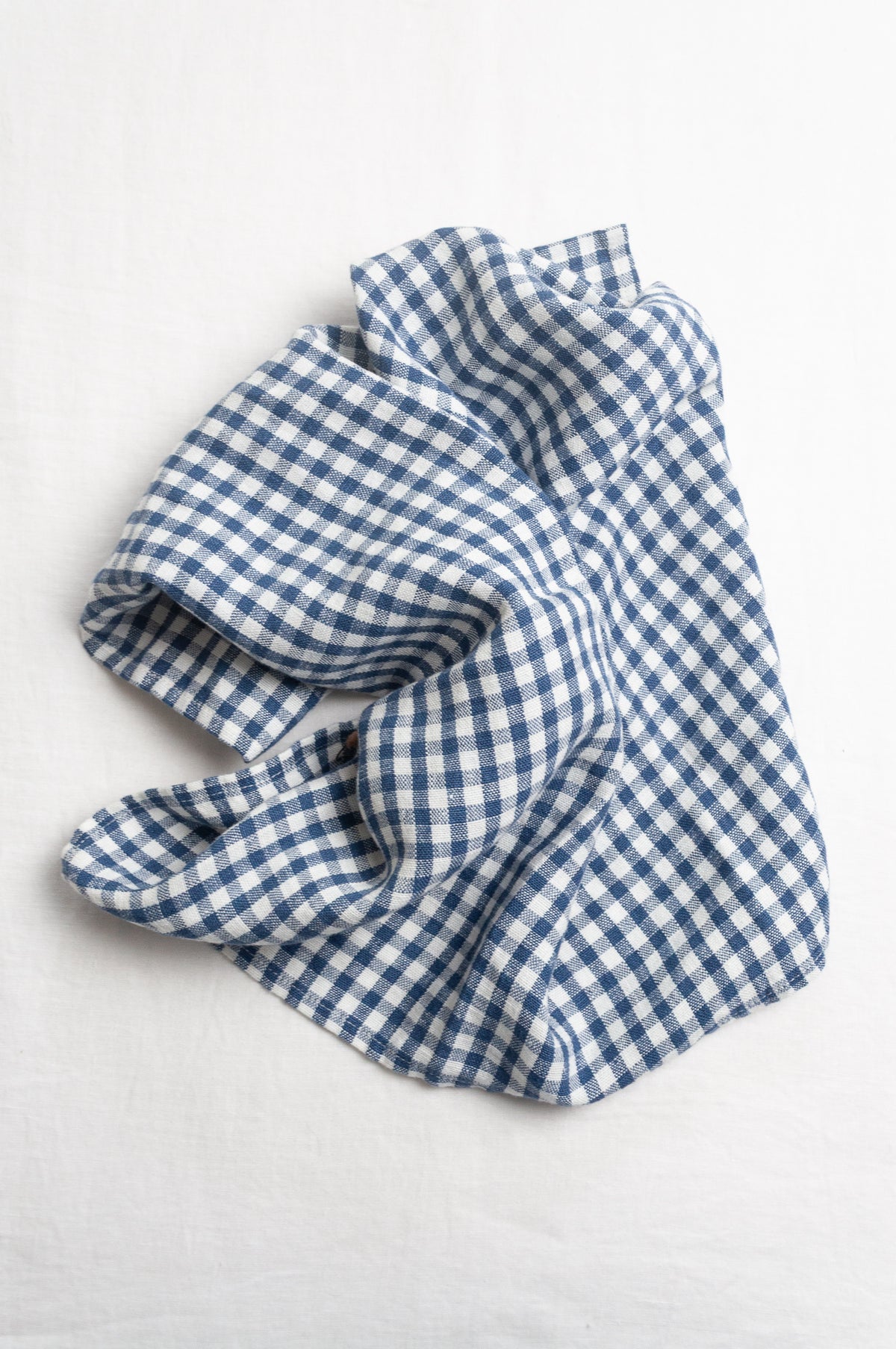 Made in Lithuania pure linen gingham tea towel in indigo blue and white.