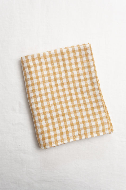 Made in Lituhuania pure linen gingham tea towel in mustard yellow and white.