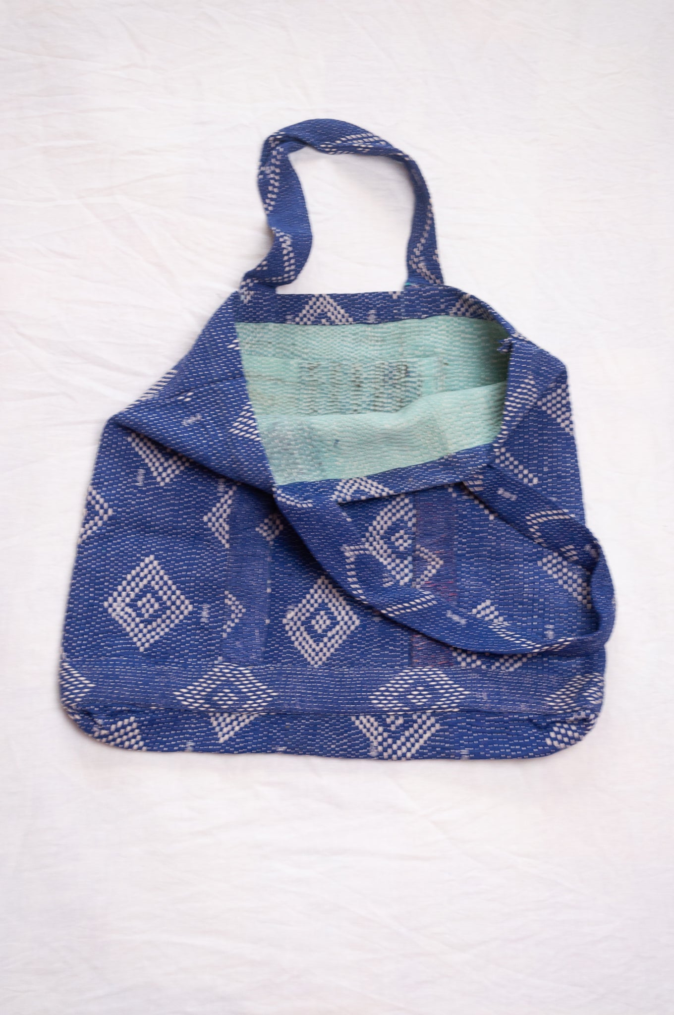 Vintage embroidered kantha quilt market tote bag in sapphire blue.