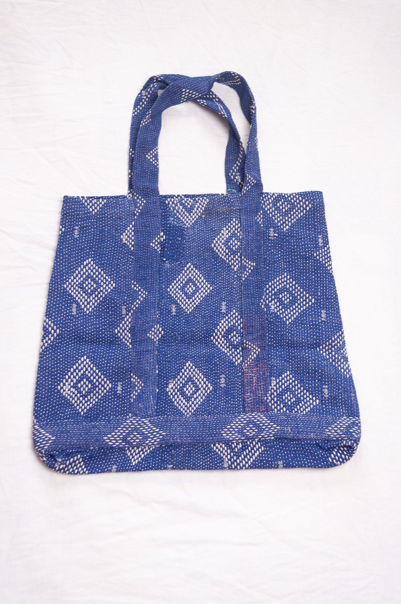Vintage embroidered kantha quilt market tote bag in sapphire blue.