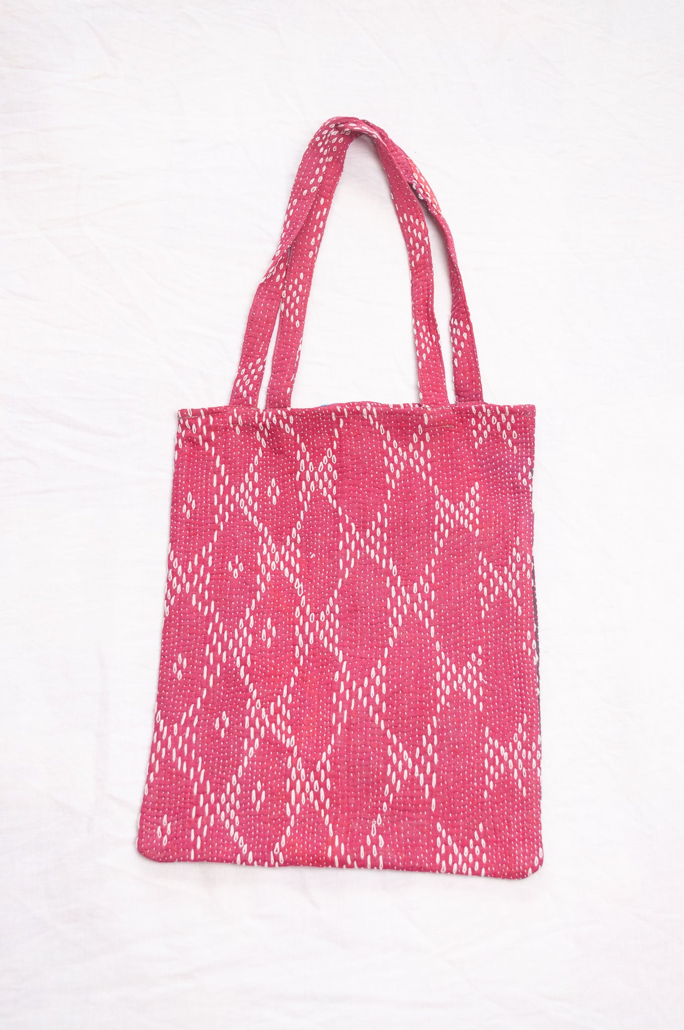 Vintage embroidered kantha quilt tote bag in raspberry red.