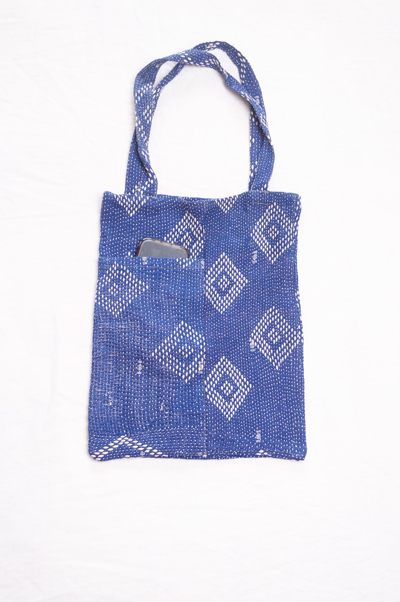 Vintage embroidered kantha quilt tote bag in sapphire blue.