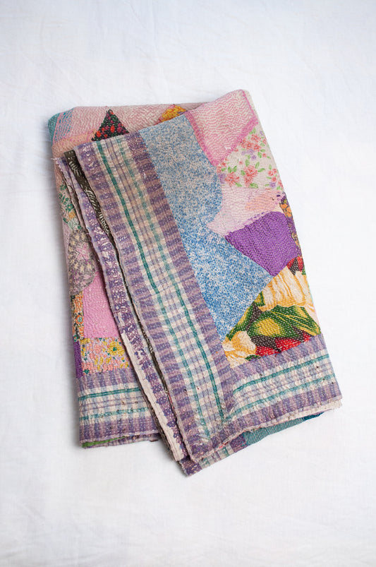Crazy patchwork kantha quilt in retro prints and plains.