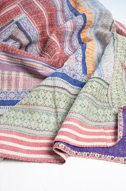 Multi striped coloured vintage kantha quilt.