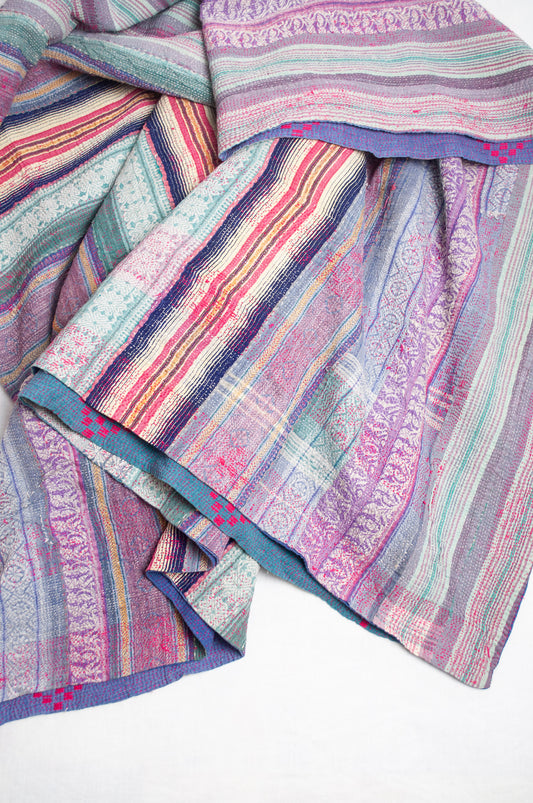 Striped vintage kantha quilt in mauve and green.
