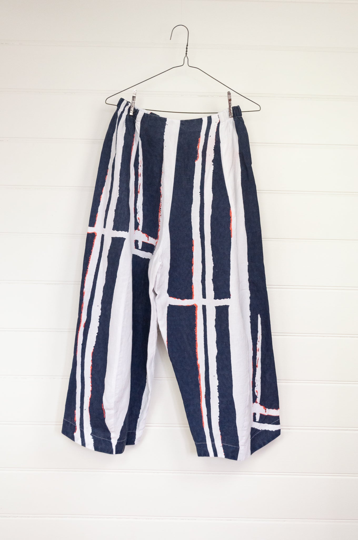 Banana Blue bold stripe blue and white linen pants, with a dash of neon orange.