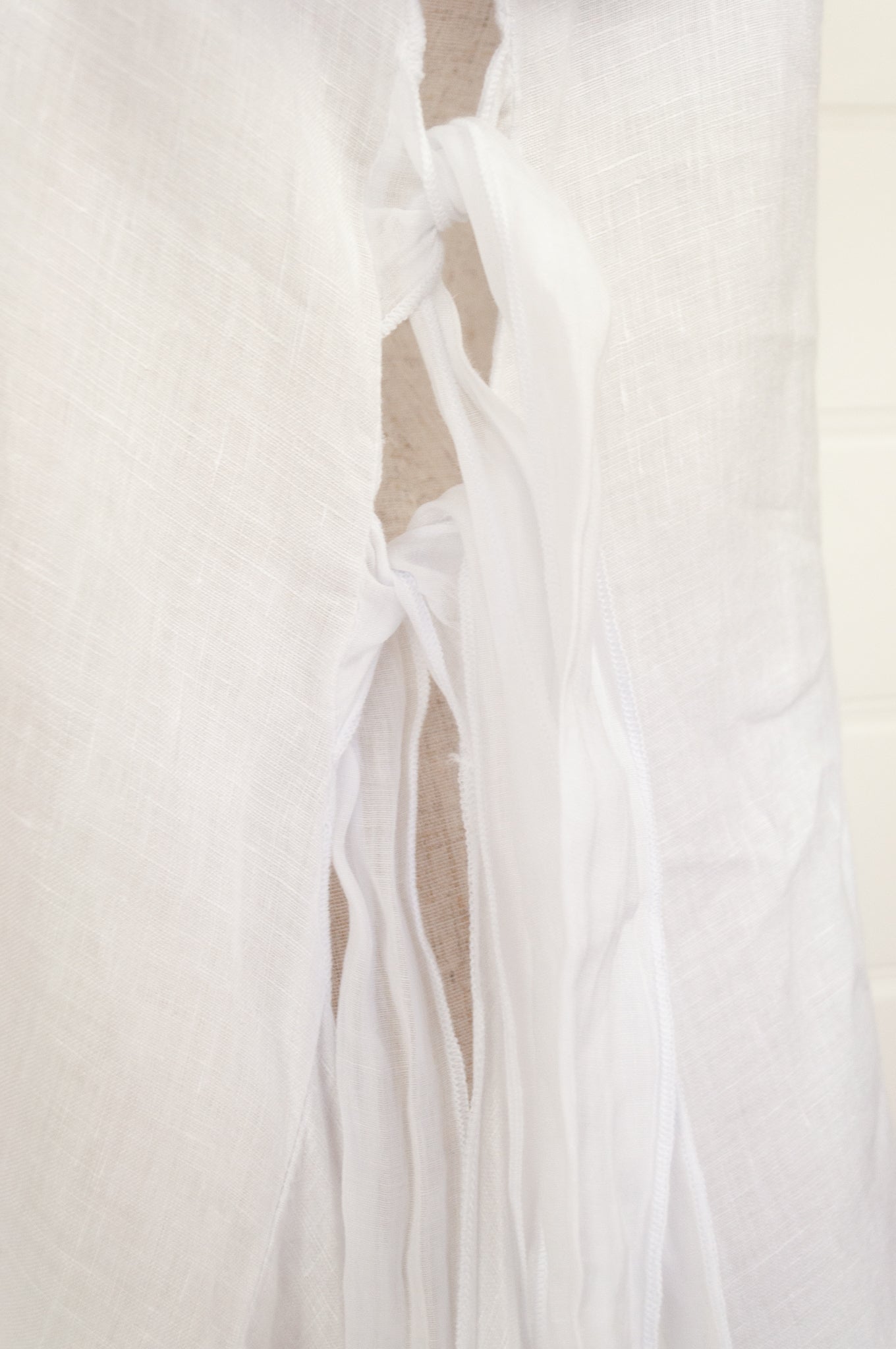 Banana Blue white linen tunic with side ties.