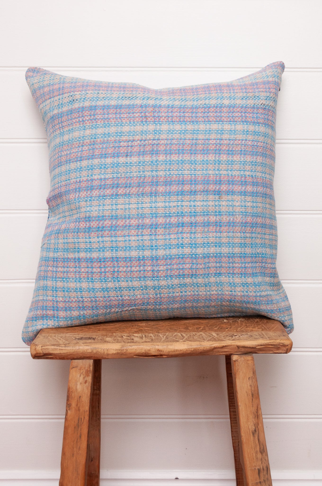 Vintage kantha quilt cushion in blue and lavender plaid.