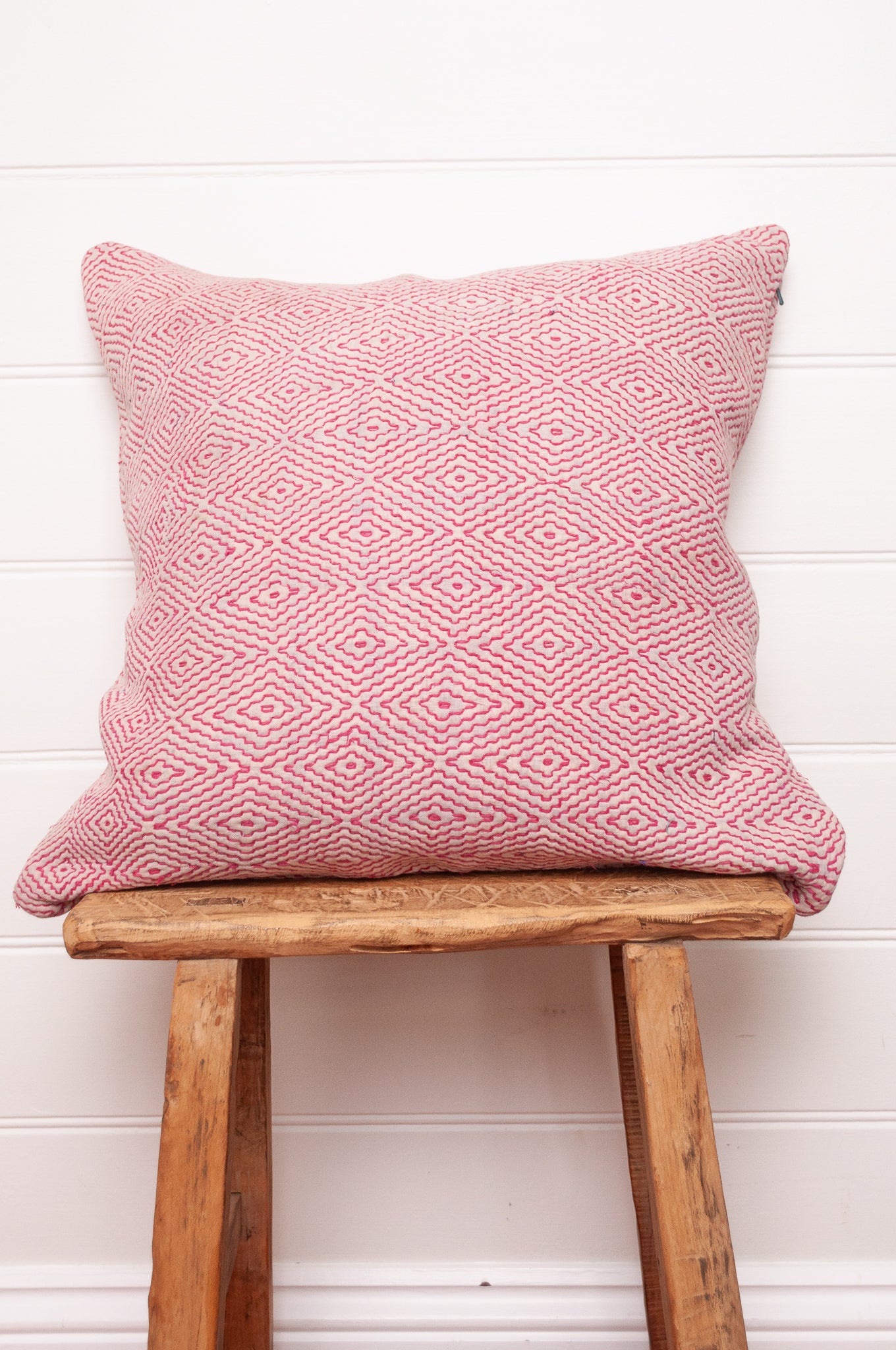 VIntage kantha quilt cushion embroidered red  diamonds on white.