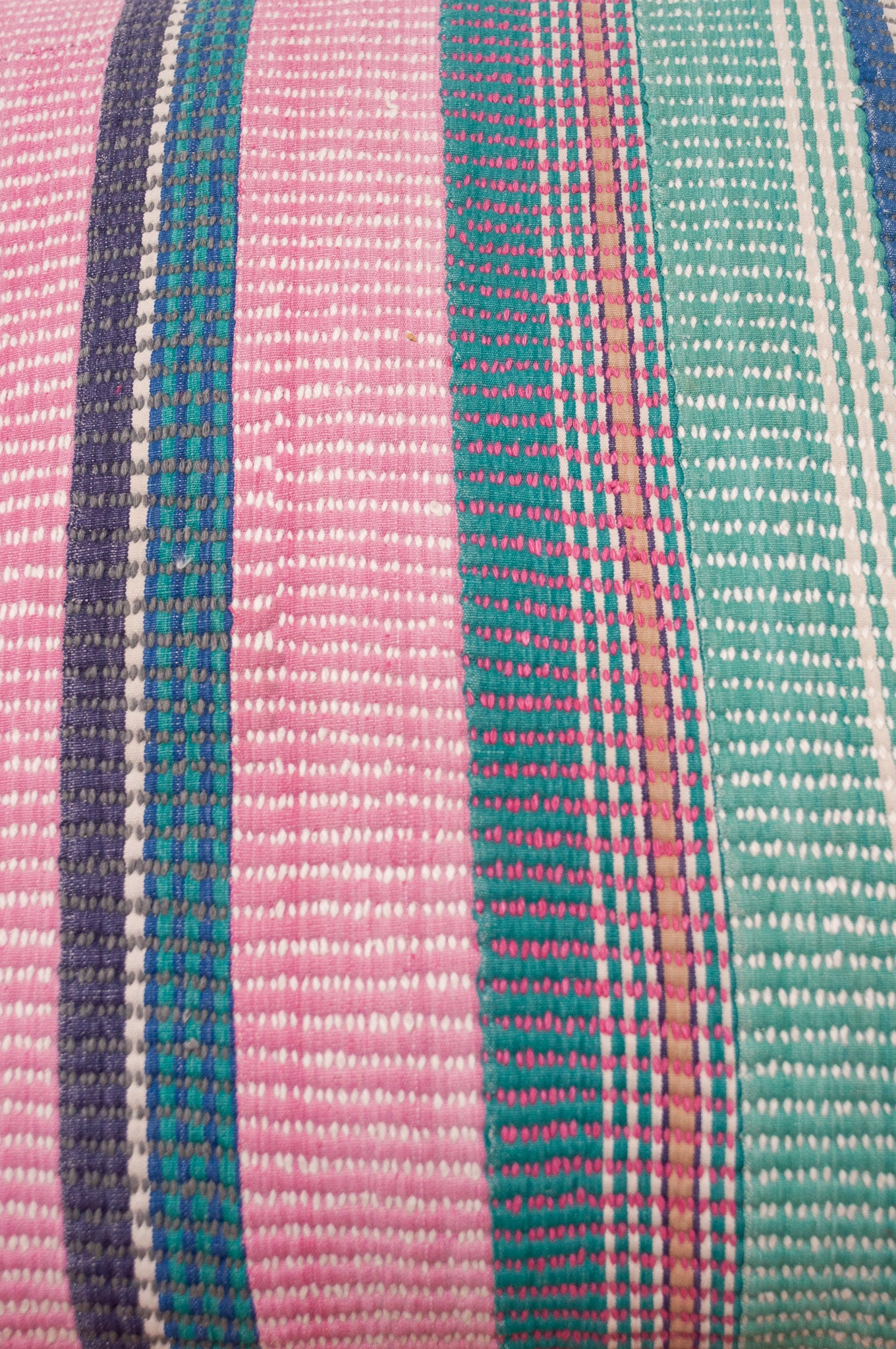 Vintage kantha cushion with stripes in pink, blue and green, finely stitched.